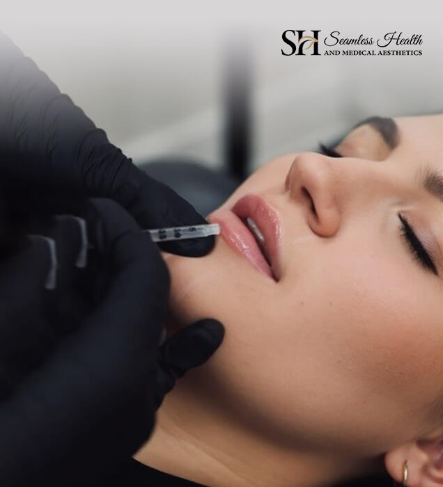 Dermal filler being injected along a patient's cheek