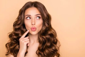 Woman with pursed lips thinking about lip filler